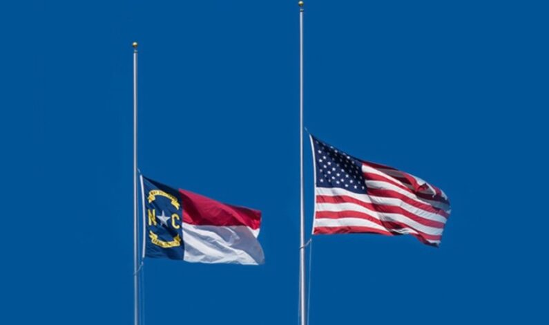 Half-staff flags honor fallen Coast Guard ensign Half-staff flags honor fallen Coast Guard ensign